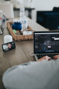 Image of computer and phone on table - working from hom